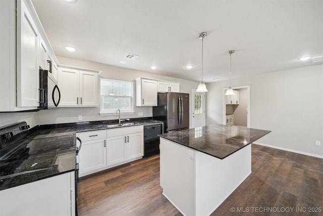 112 E Loy Ave, Chouteau, OK 74337 - kitchen featuring black appliances, plenty of natural light, white cabinetry, and recessed lighting