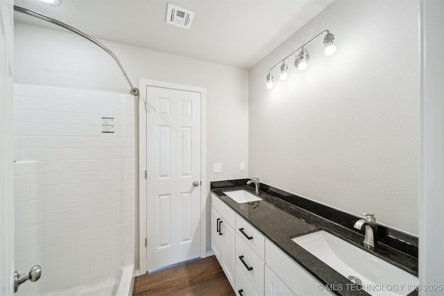 112 E Loy Ave, Chouteau, OK 74337 - full bath featuring double vanity, a shower, and wood finished floors