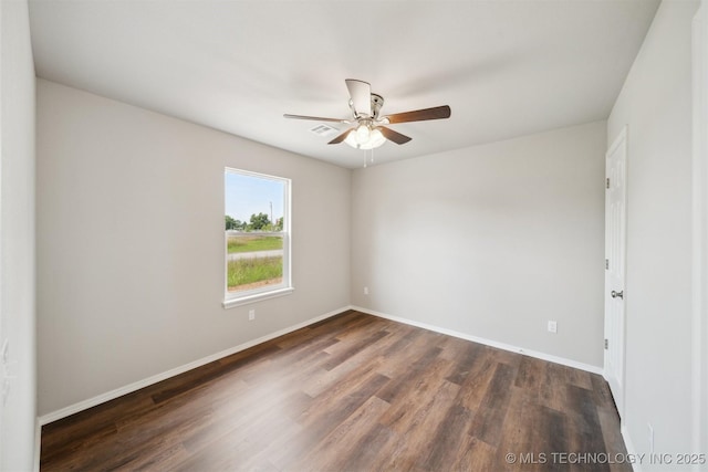 112 E Loy Ave, Chouteau, OK 74337 - empty room with dark wood-style flooring and ceiling fan