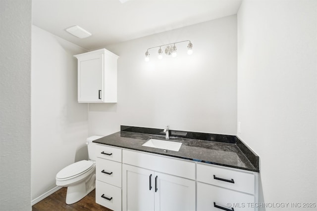 112 E Loy Ave, Chouteau, OK 74337 - bathroom with vanity and wood finished floors