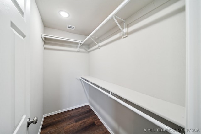 112 E Loy Ave, Chouteau, OK 74337 - walk in closet featuring dark wood-type flooring