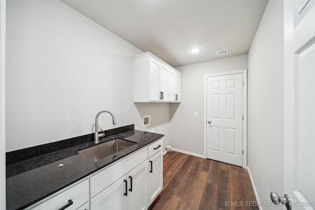 112 E Loy Ave, Chouteau, OK 74337 - washroom featuring washer hookup, cabinet space, dark wood-style floors, and recessed lighting