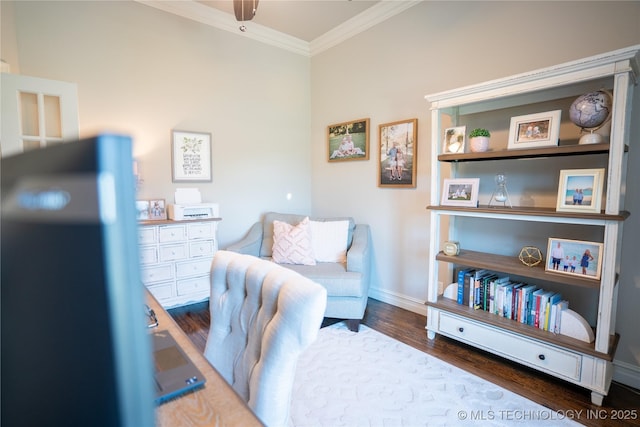 home office with wood finished floors, ornamental molding, baseboards, and ceiling fan