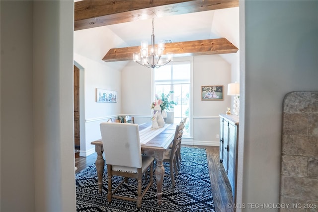 dining area with a chandelier, wood finished floors, and baseboards