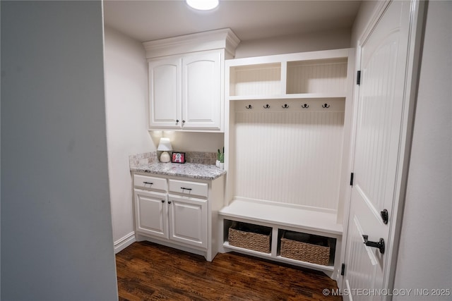 mudroom featuring dark wood finished floors