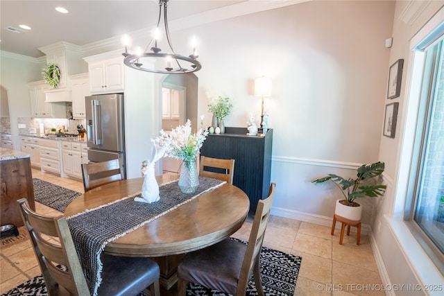 dining space with a chandelier, baseboards, ornamental molding, and recessed lighting