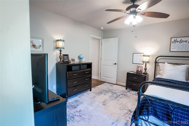 bedroom with baseboards and ceiling fan