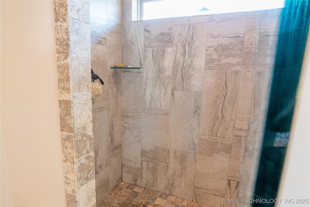 full bathroom featuring tiled shower