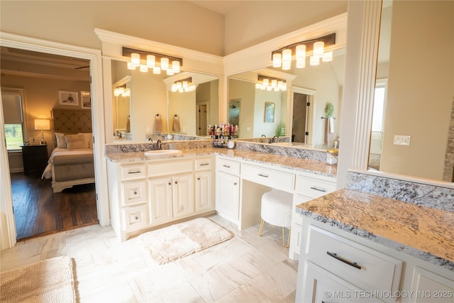 ensuite bathroom featuring vanity