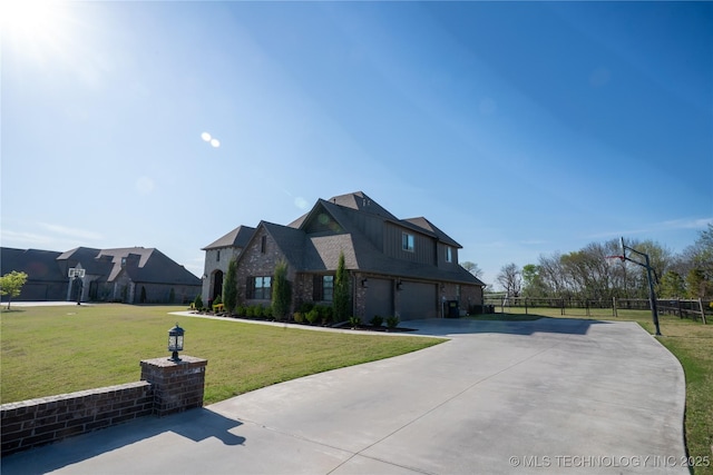 view of front of house featuring an attached garage, asphalt driveway, and brick siding