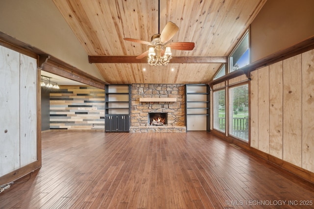 unfurnished living room featuring hardwood / wood-style floors, wood ceiling, ceiling fan, a fireplace, and baseboards