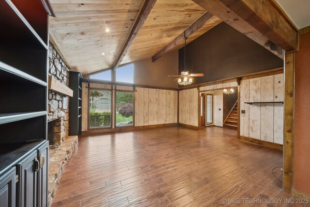 1405 W Huntsville St, Broken Arrow, OK 74011 - unfurnished living room featuring hardwood / wood-style floors, a ceiling fan, stairs, wooden walls, and wooden ceiling with exposed beams