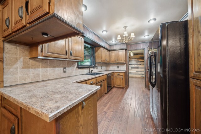 1405 W Huntsville St, Broken Arrow, OK 74011 - kitchen with black appliances, a sink, brown cabinets, a chandelier, and light countertops