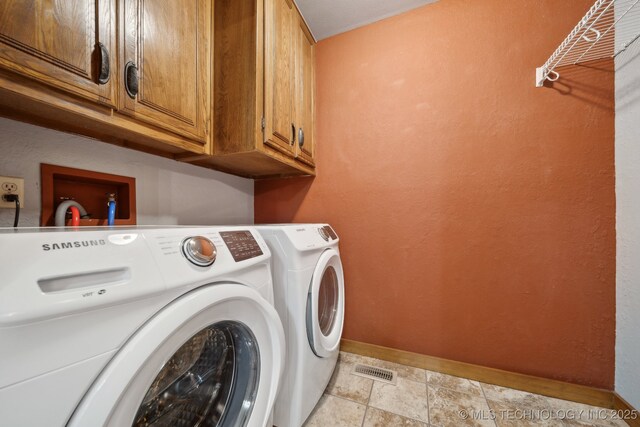 1405 W Huntsville St, Broken Arrow, OK 74011 - laundry room with cabinet space, separate washer and dryer, baseboards, light stone finish flooring, and a textured wall