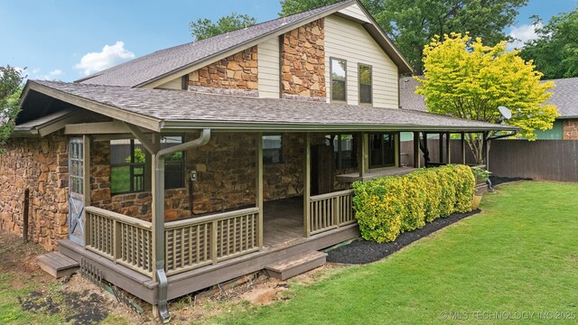 1405 W Huntsville St, Broken Arrow, OK 74011 - rear view of property featuring stone siding and a shingled roof