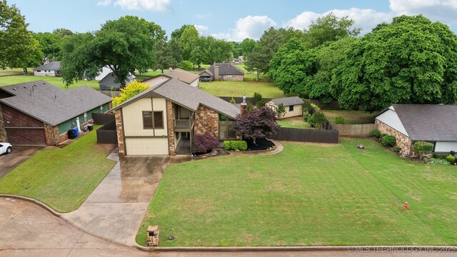 1405 W Huntsville St, Broken Arrow, OK 74011 - view of front of property with brick siding, driveway, a garage, a balcony, and a residential view