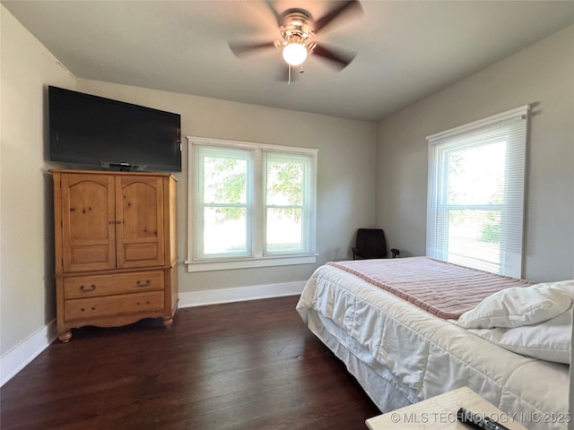 bedroom with dark wood finished floors, baseboards, and a ceiling fan