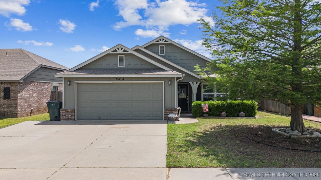 15204 E 110th Pl N, Owasso, OK 74055 - craftsman house with driveway, a garage, and brick siding