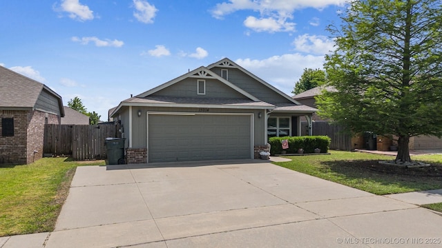 craftsman inspired home with a garage and concrete driveway