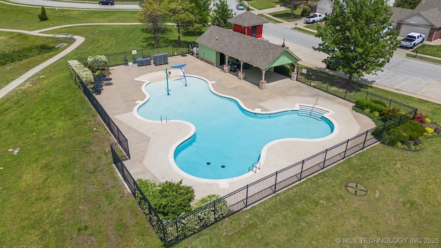 community pool featuring a patio area