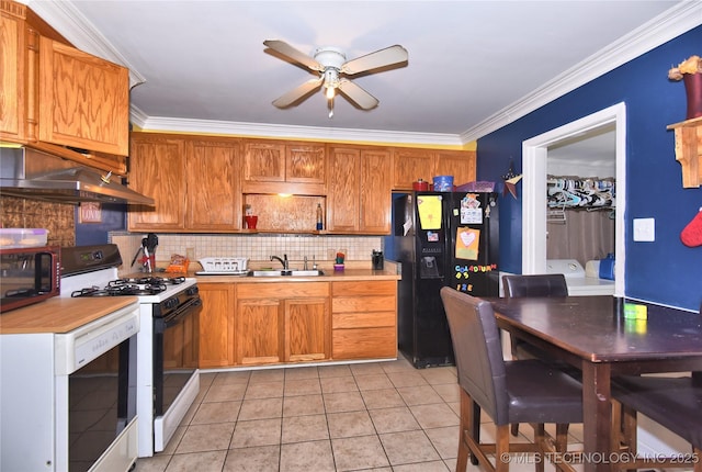 kitchen featuring black appliances, a sink, under cabinet range hood, light countertops, and ceiling fan