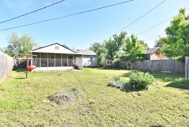 view of yard with a sunroom