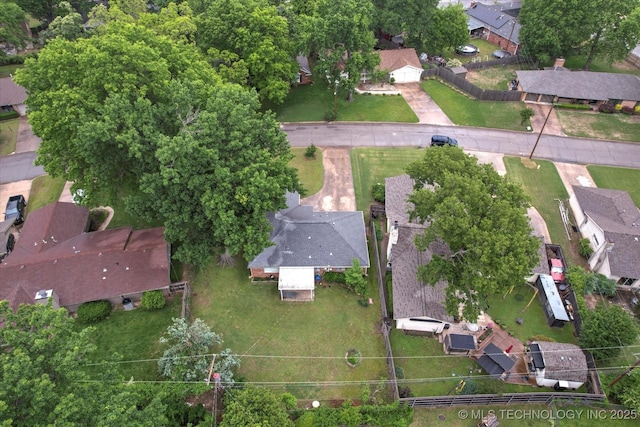 aerial view of property and surrounding area with nearby suburban area