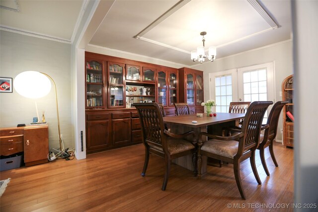 5518 E 46th St Unit 5518, Tulsa, OK 74135 - dining area featuring a chandelier, ornamental molding, and light wood finished floors