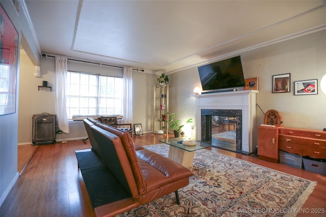 5518 E 46th St Unit 5518, Tulsa, OK 74135 - living room with wood finished floors, a fireplace, baseboards, and ornamental molding
