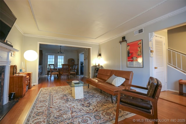 5518 E 46th St Unit 5518, Tulsa, OK 74135 - living area with wood finished floors, stairs, crown molding, and baseboards