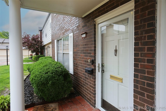 5518 E 46th St Unit 5518, Tulsa, OK 74135 - view of exterior entry featuring brick siding