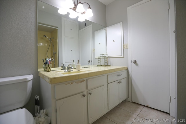 5518 E 46th St Unit 5518, Tulsa, OK 74135 - bathroom with a chandelier, tile patterned flooring, toilet, a shower, and vanity