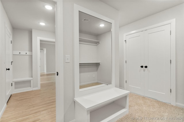 mudroom featuring baseboards, recessed lighting, and wood finished floors