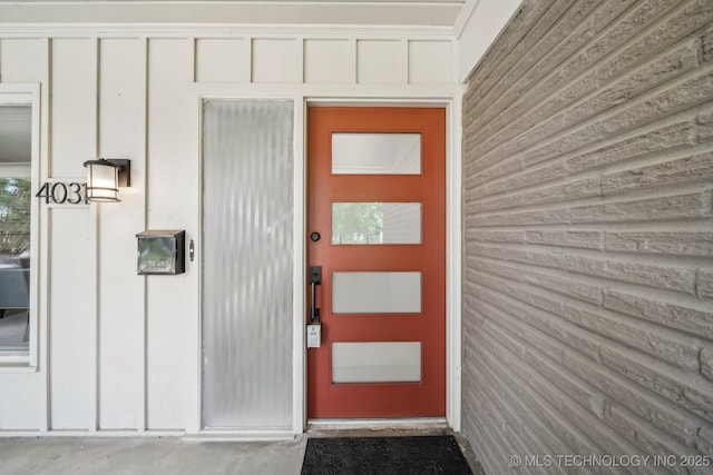 4031 S Birmingham Ave, Tulsa, OK 74105 - property entrance with board and batten siding