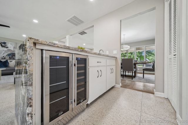 4031 S Birmingham Ave, Tulsa, OK 74105 - bar with wine cooler, dark aggregate flooring, baseboards, and recessed lighting