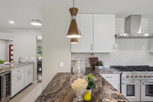 4031 S Birmingham Ave, Tulsa, OK 74105 - kitchen featuring double oven range, wall chimney exhaust hood, beverage cooler, a sink, and stone counters