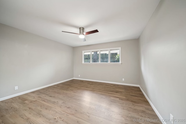 4031 S Birmingham Ave, Tulsa, OK 74105 - empty room with a ceiling fan, wood finished floors, and baseboards