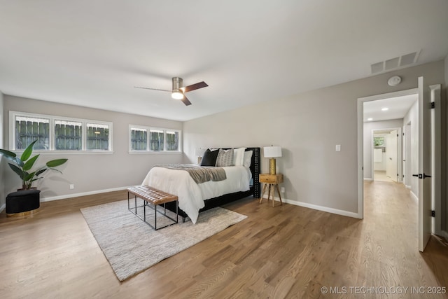 4031 S Birmingham Ave, Tulsa, OK 74105 - bedroom with wood finished floors, ceiling fan, and baseboards