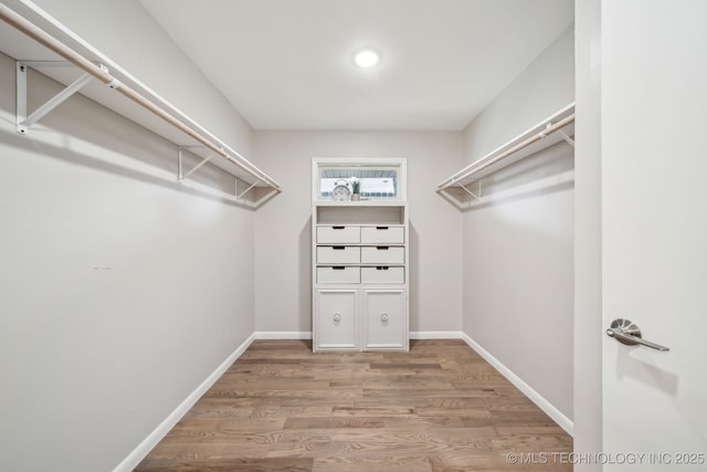 4031 S Birmingham Ave, Tulsa, OK 74105 - spacious closet with wood finished floors
