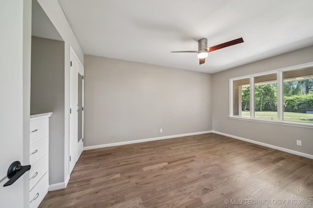 4031 S Birmingham Ave, Tulsa, OK 74105 - unfurnished room with a ceiling fan, baseboards, and wood finished floors