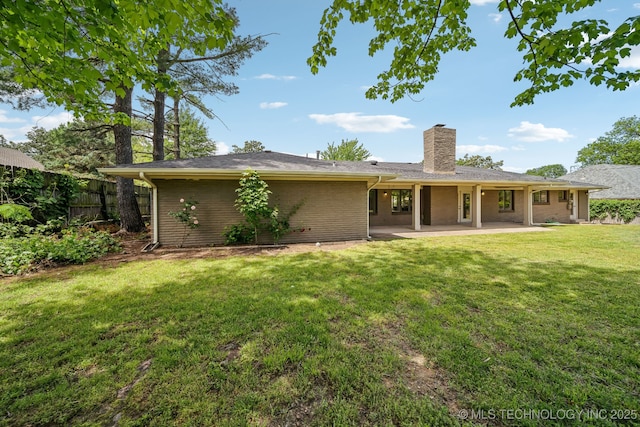 4031 S Birmingham Ave, Tulsa, OK 74105 - back of property featuring a chimney and a patio