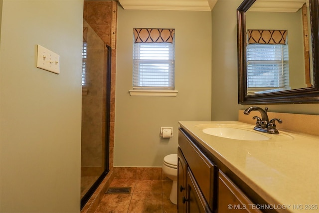 full bathroom with vanity, ornamental molding, a stall shower, toilet, and tile patterned flooring