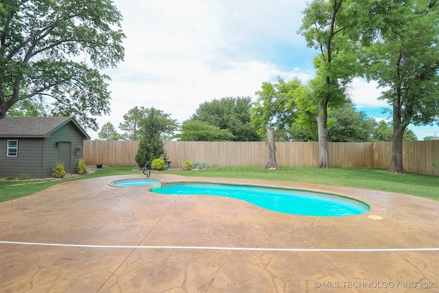 view of pool with an outdoor structure and a patio area