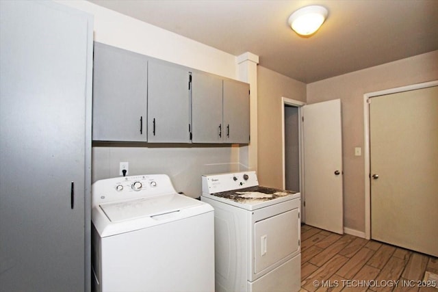 washroom featuring light wood finished floors and washing machine and dryer
