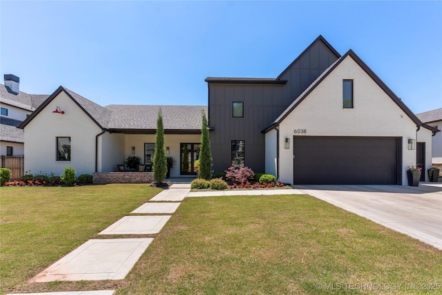 6038 E 119th Pl, Tulsa, OK 74137 - view of front of property with board and batten siding, an attached garage, driveway, a front yard, and brick siding