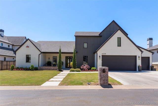 6038 E 119th Pl, Tulsa, OK 74137 - view of front of property featuring board and batten siding, driveway, brick siding, a shingled roof, and an attached garage