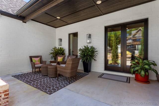 6038 E 119th Pl, Tulsa, OK 74137 - view of patio / terrace featuring french doors