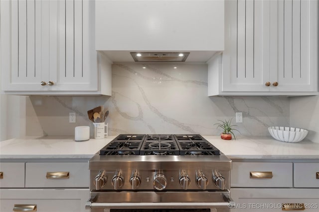 6038 E 119th Pl, Tulsa, OK 74137 - kitchen with stainless steel range with gas cooktop, white cabinetry, decorative backsplash, and light stone counters