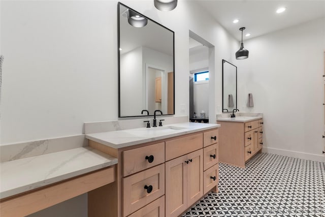 6038 E 119th Pl, Tulsa, OK 74137 - bathroom featuring two vanities, tile patterned floors, and recessed lighting