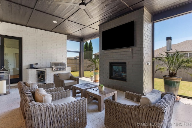6038 E 119th Pl, Tulsa, OK 74137 - view of patio featuring an outdoor kitchen, wine cooler, ceiling fan, and an outdoor living space with a fireplace